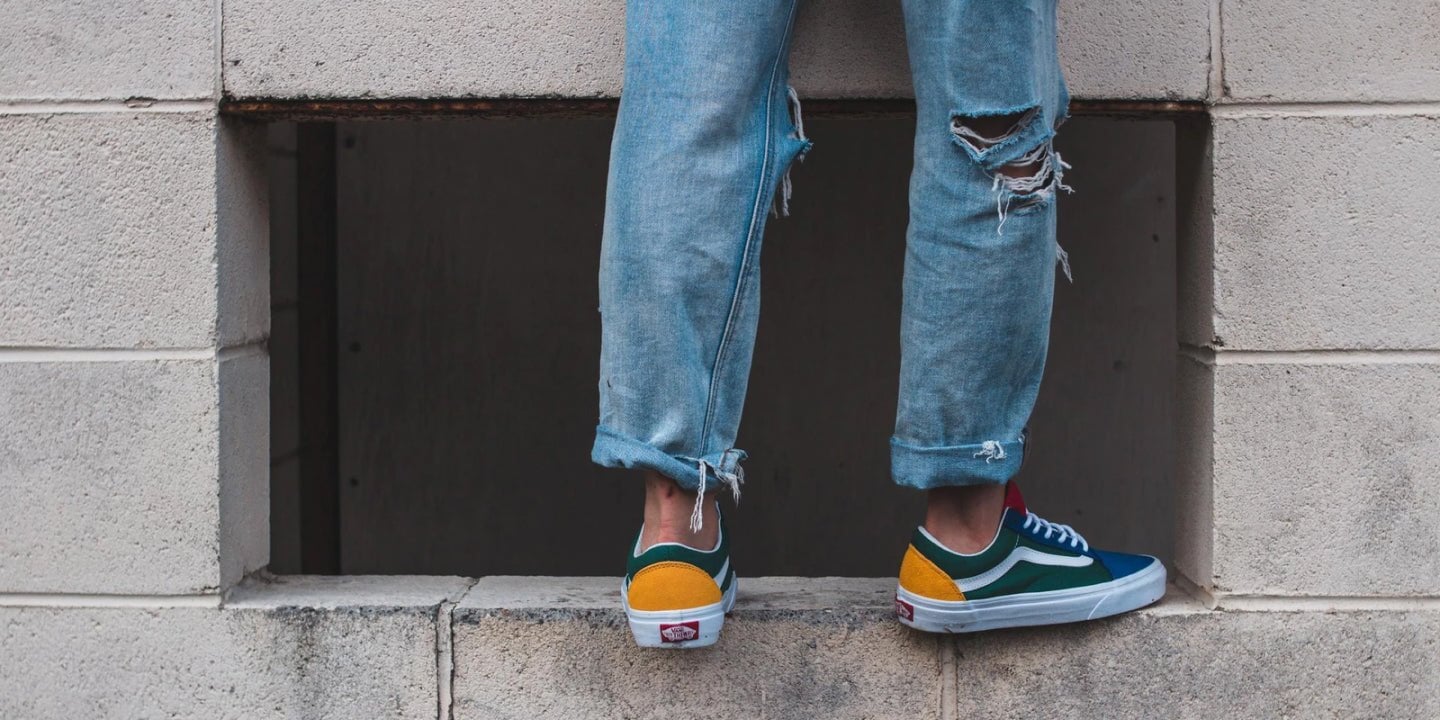 person standing on a ledge wearing DUER jeans