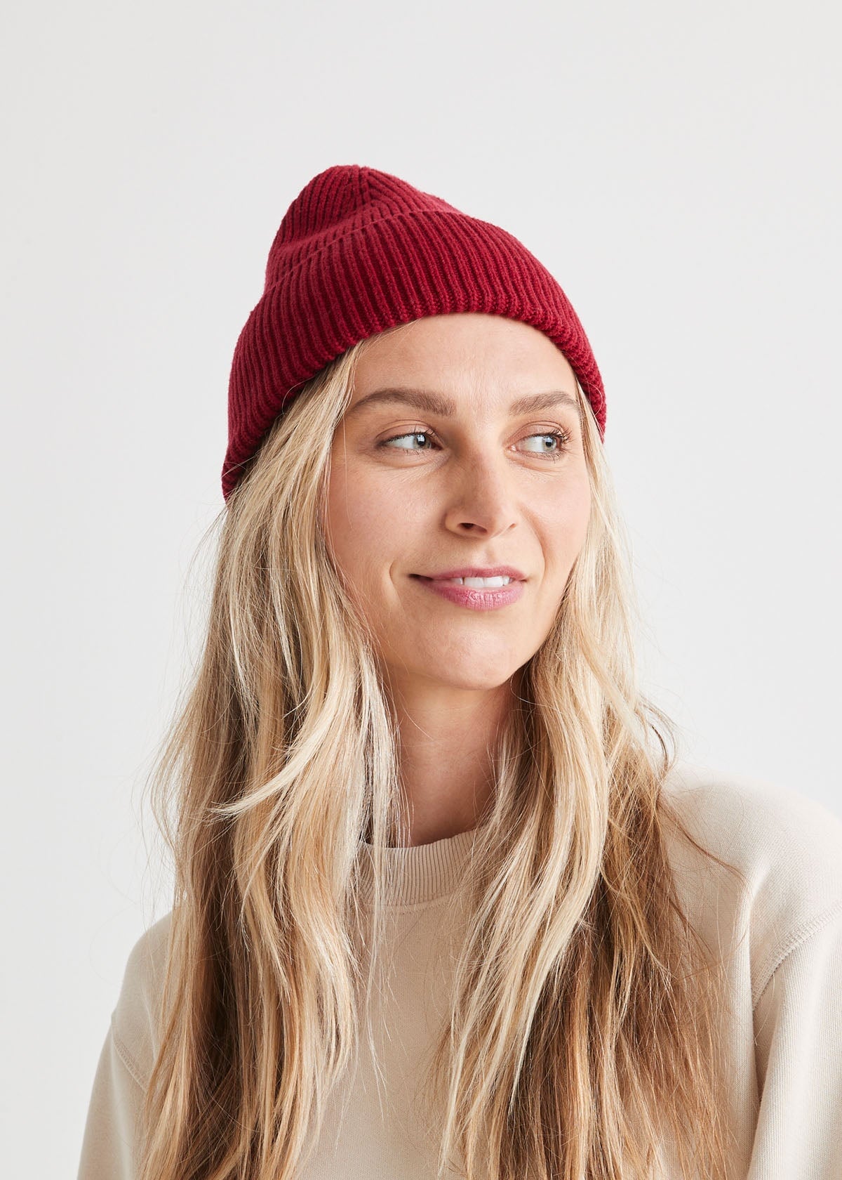 woman wearing warm merino red toque front