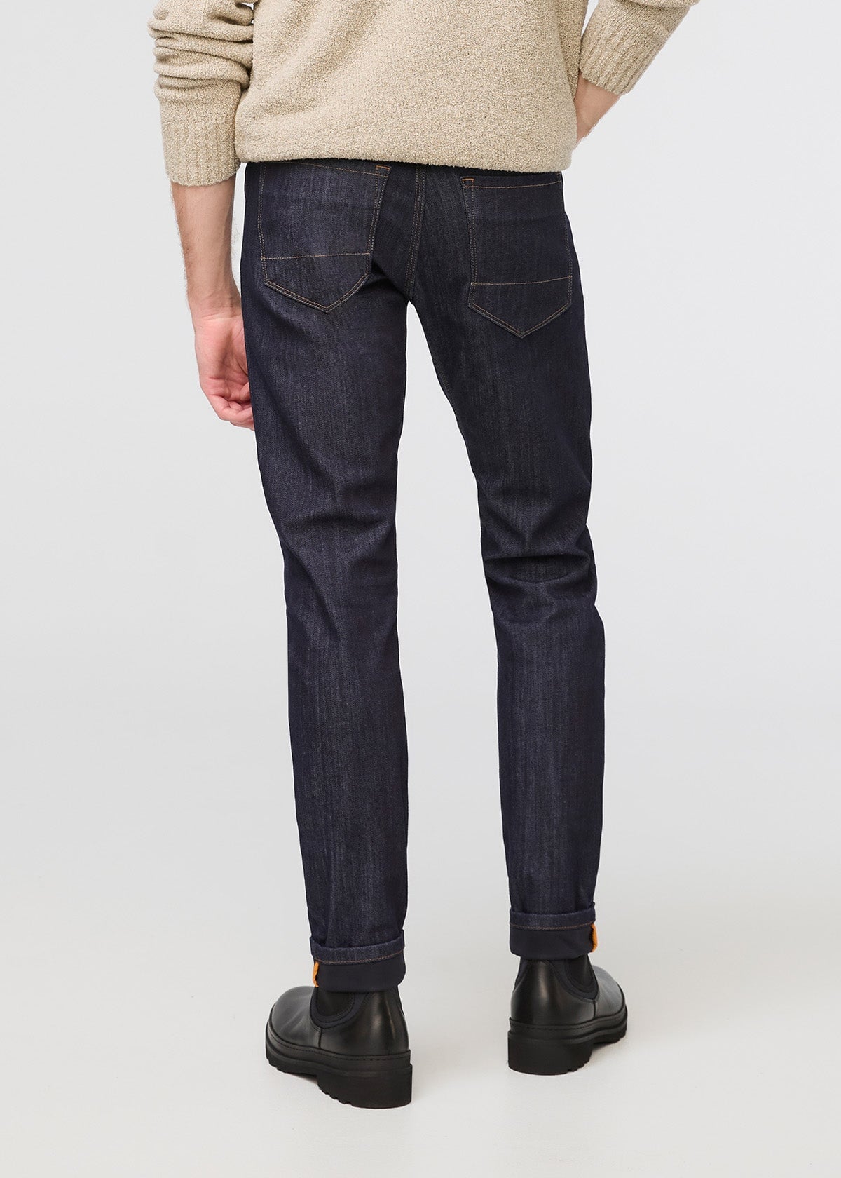 man wearing dark blue slim fit waterproof stretch jeans back