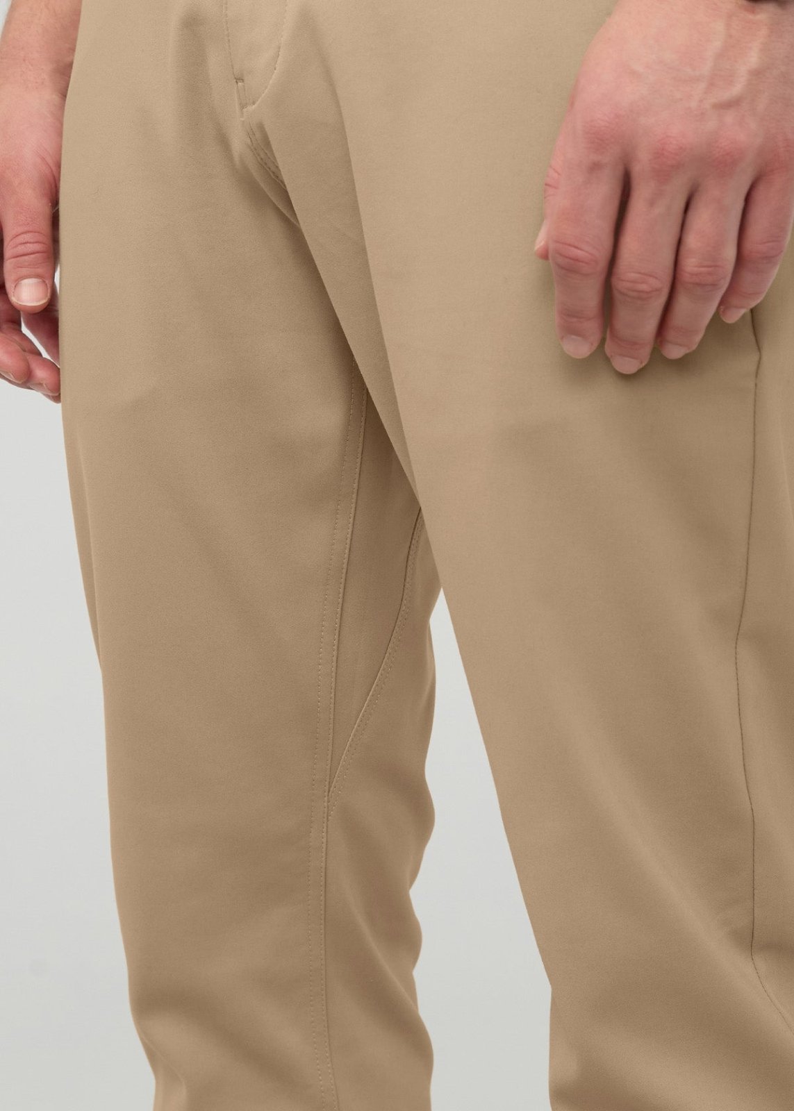 Desert khaki relaxed taper trouser with tapered leg opening, shown on model from waist to knee.
