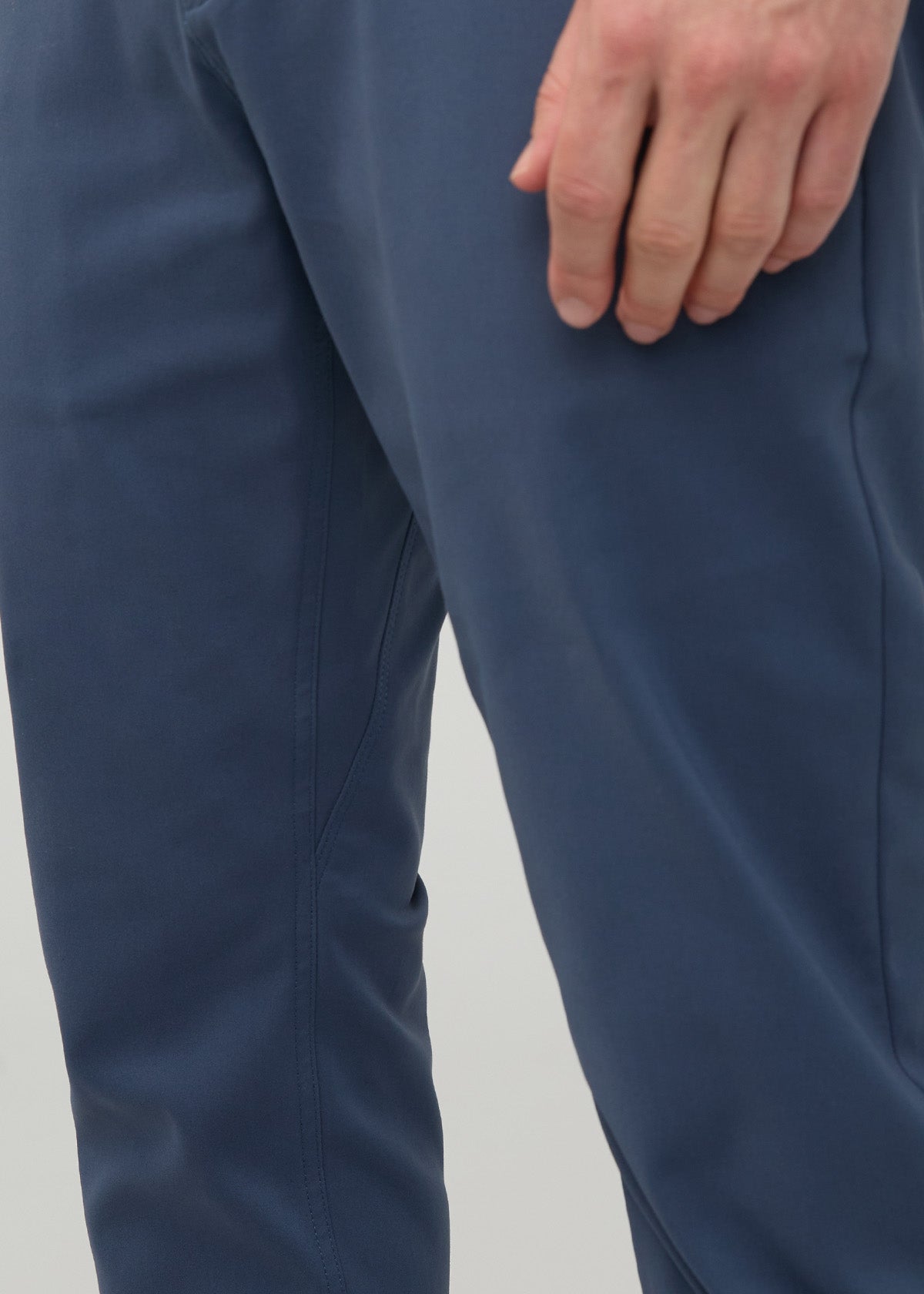 Heritage blue relaxed taper trousers with tapered ankles, shown from waist to mid-thigh on model.