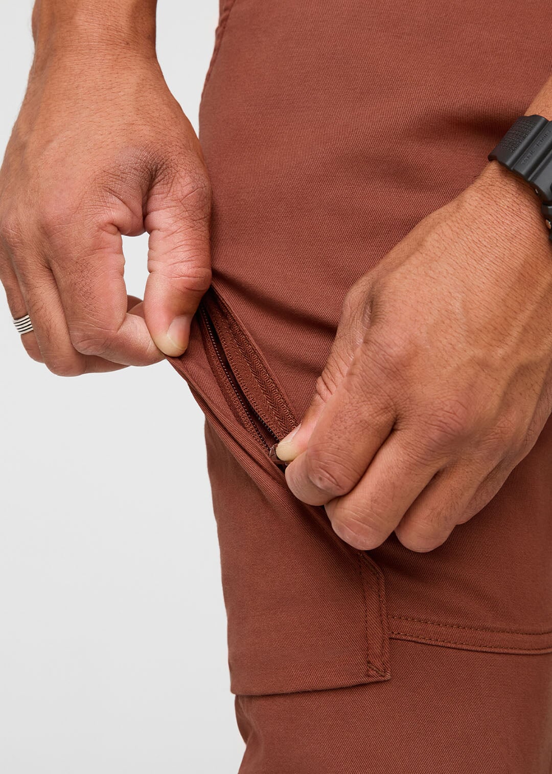 mens red-brown athletic waterproof pant thigh zip pocket detail