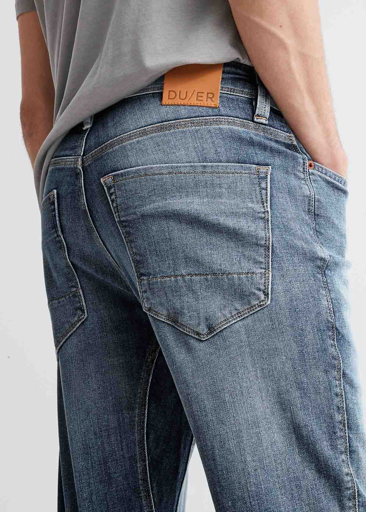 mens slim fit light blue stretch jeans back pocket and patch