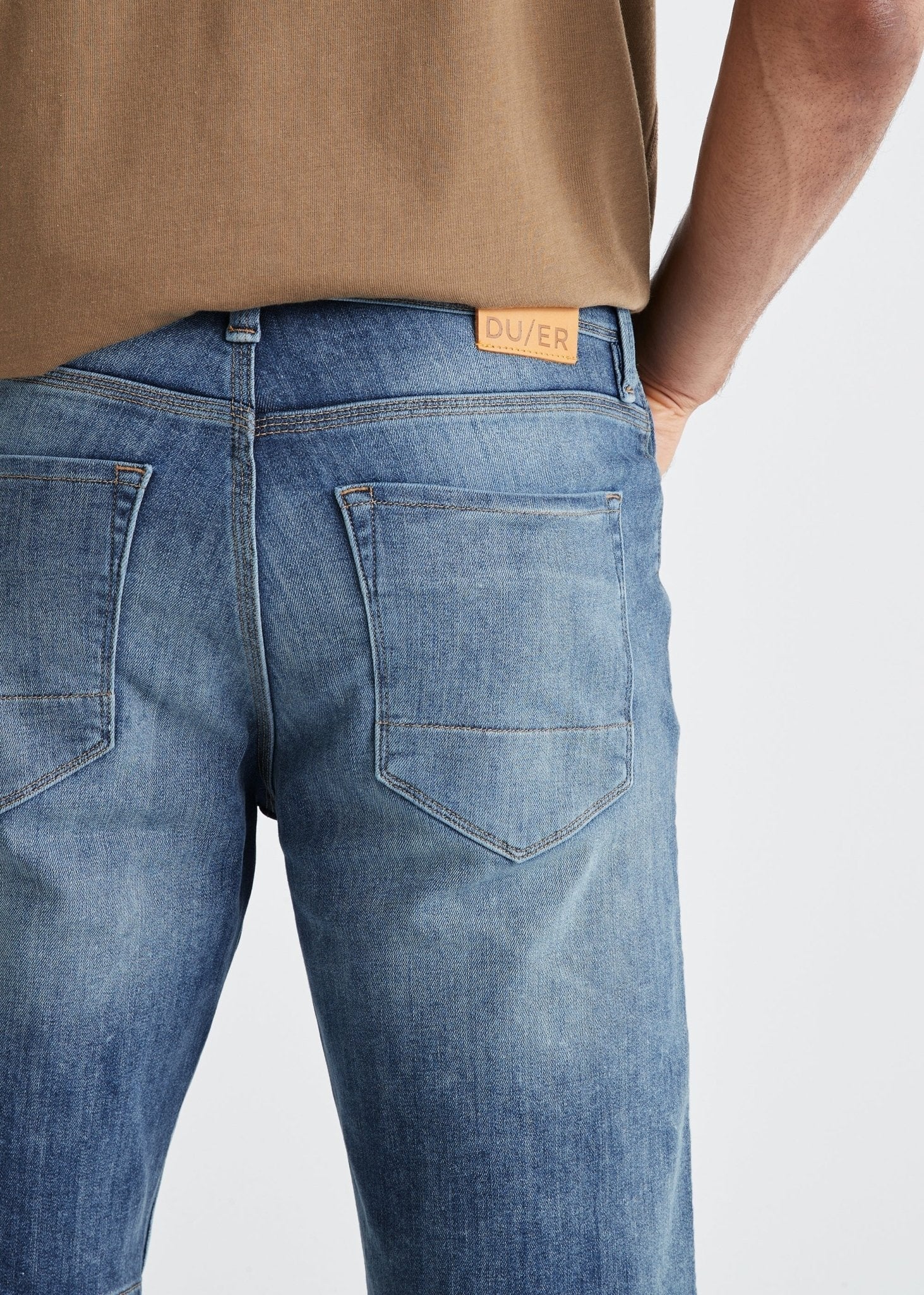mens medium wash performance denim stretch short back pocket detail