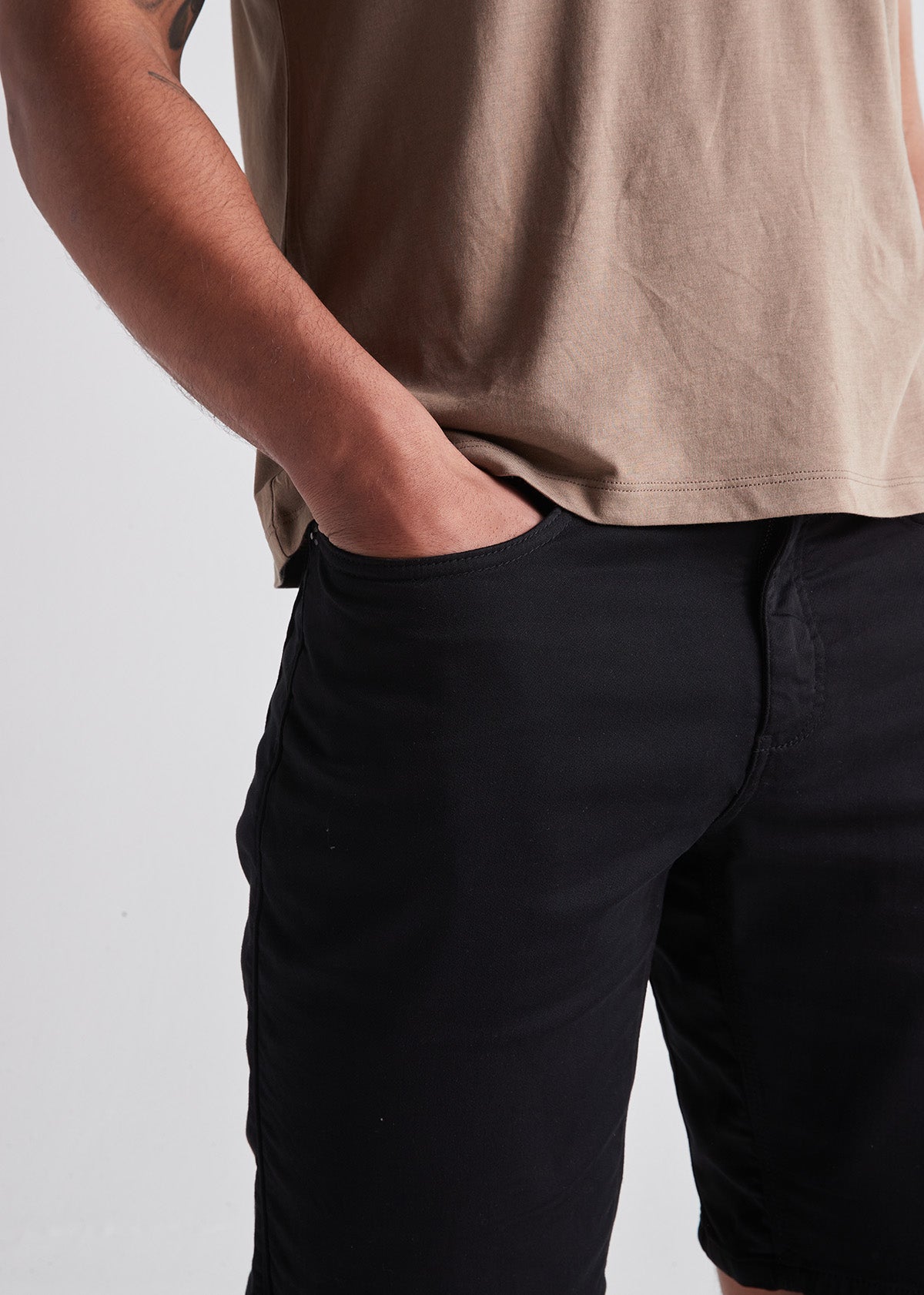 black relaxed fit performance short front pocket detail