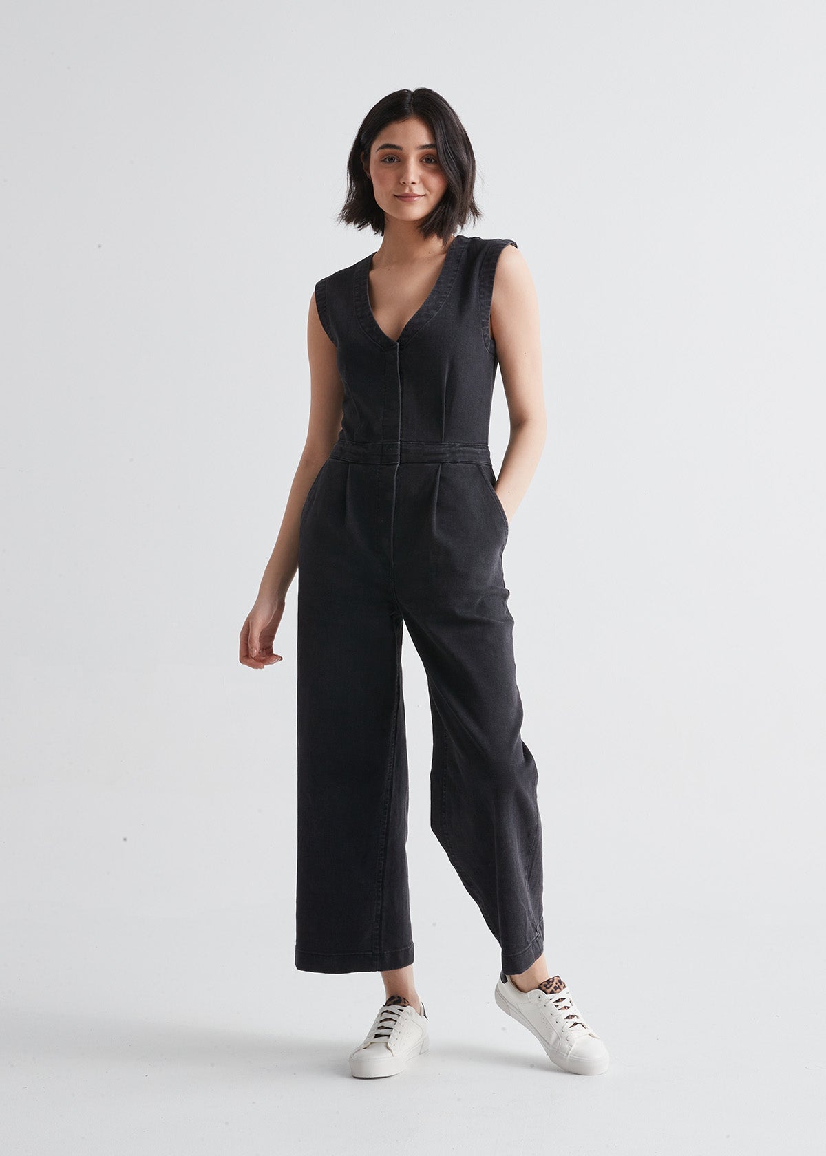 Women's Stretch Denim Tailored Black Jumpsuit Front with Sneakers